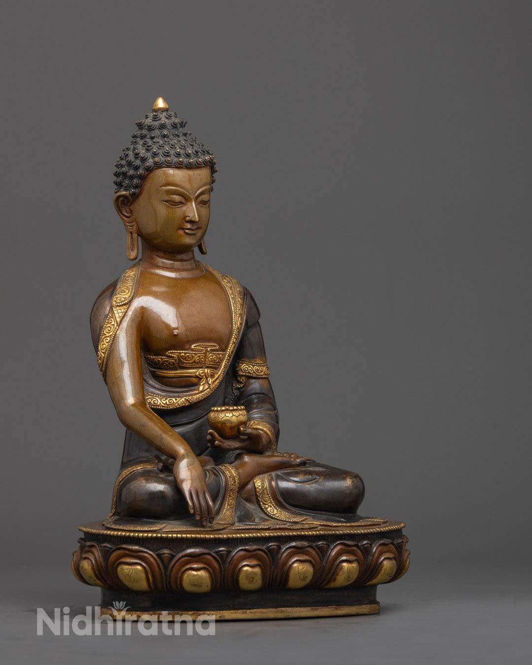 Side angle of Shakyamuni Buddha Tibetan Statue showing gilded robe details