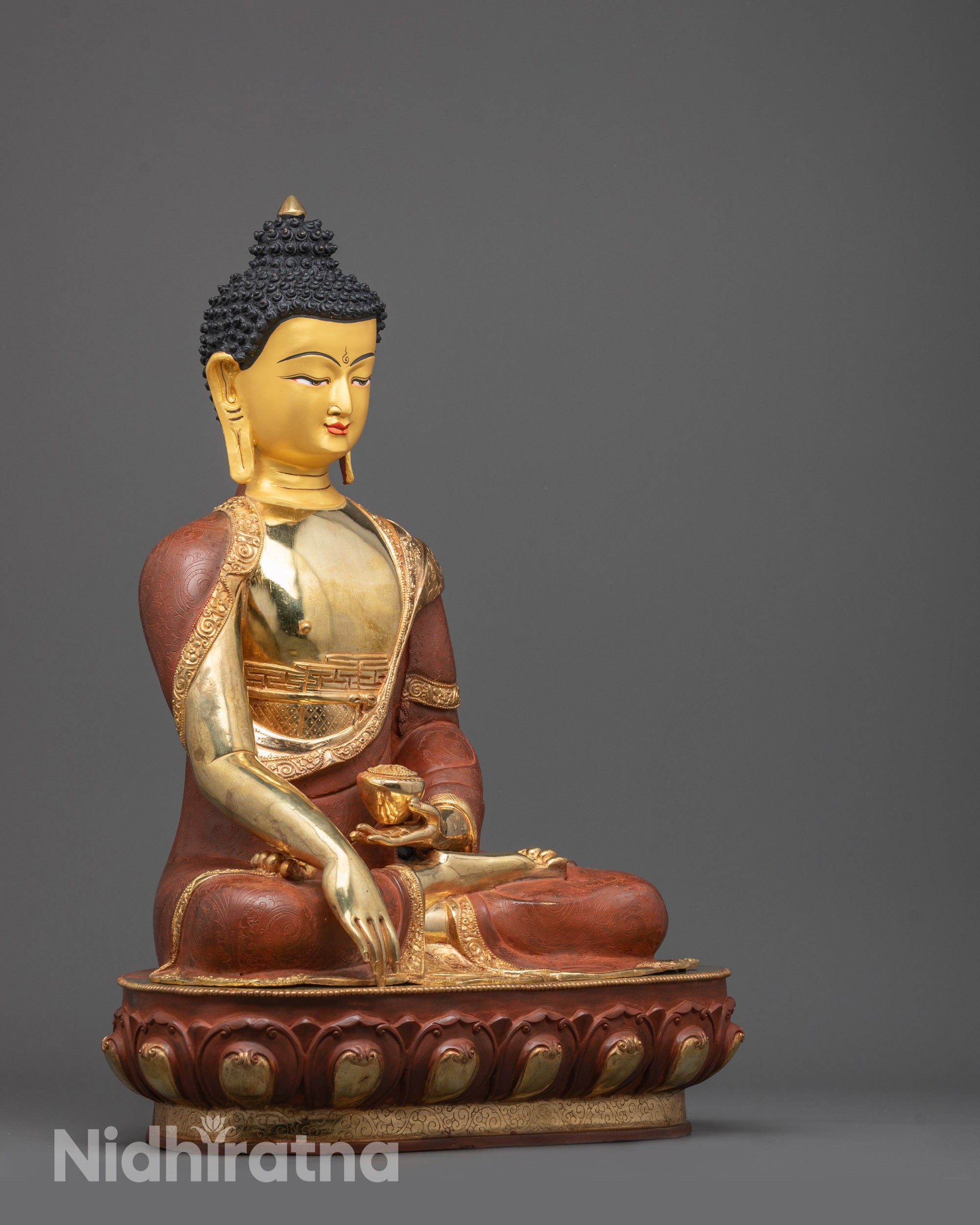 Side angle of Shakyamuni Buddha holding patra bowl in earth-touching mudra pose