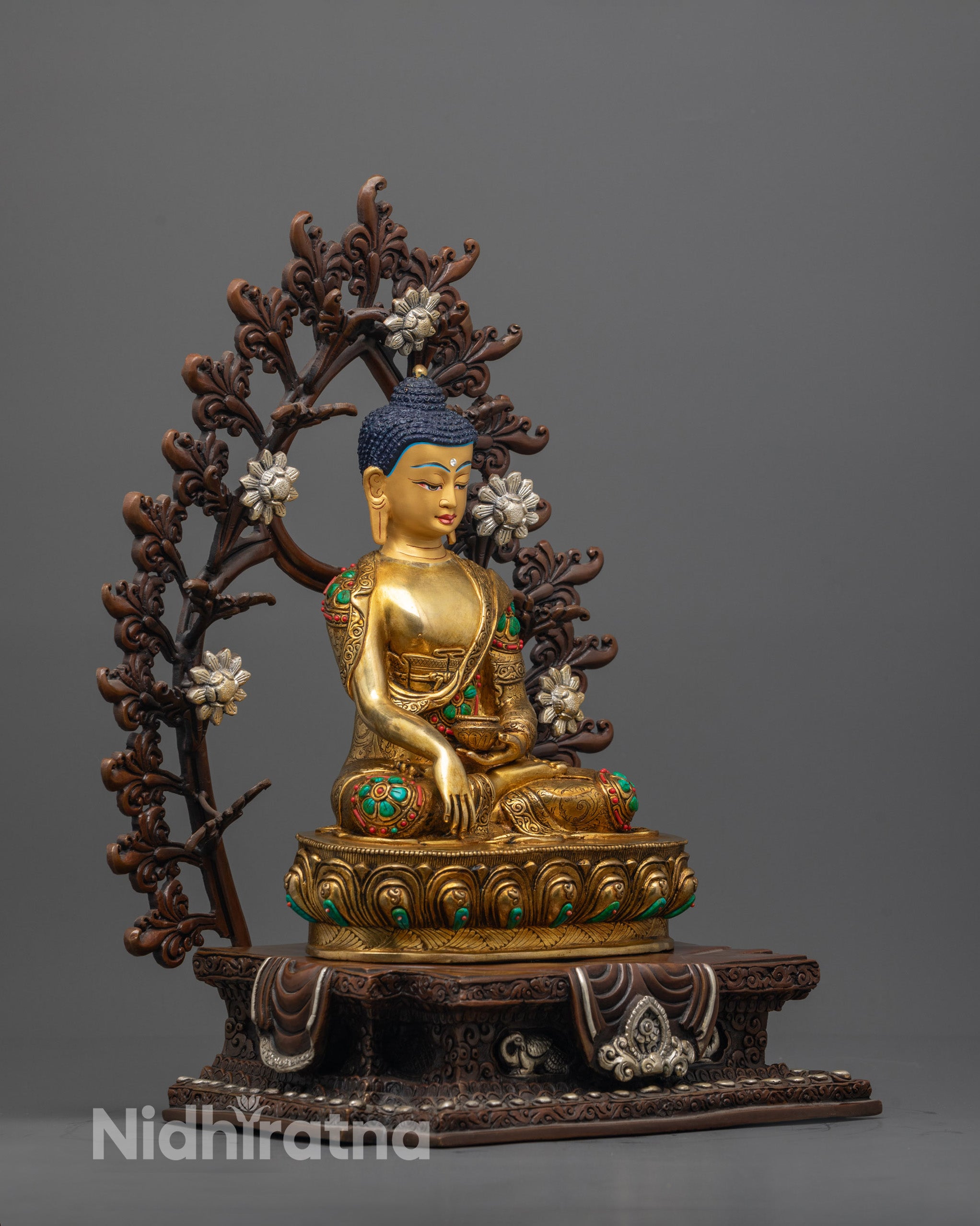Side angle of Shakyamuni Buddha seated in meditation on a lotus base