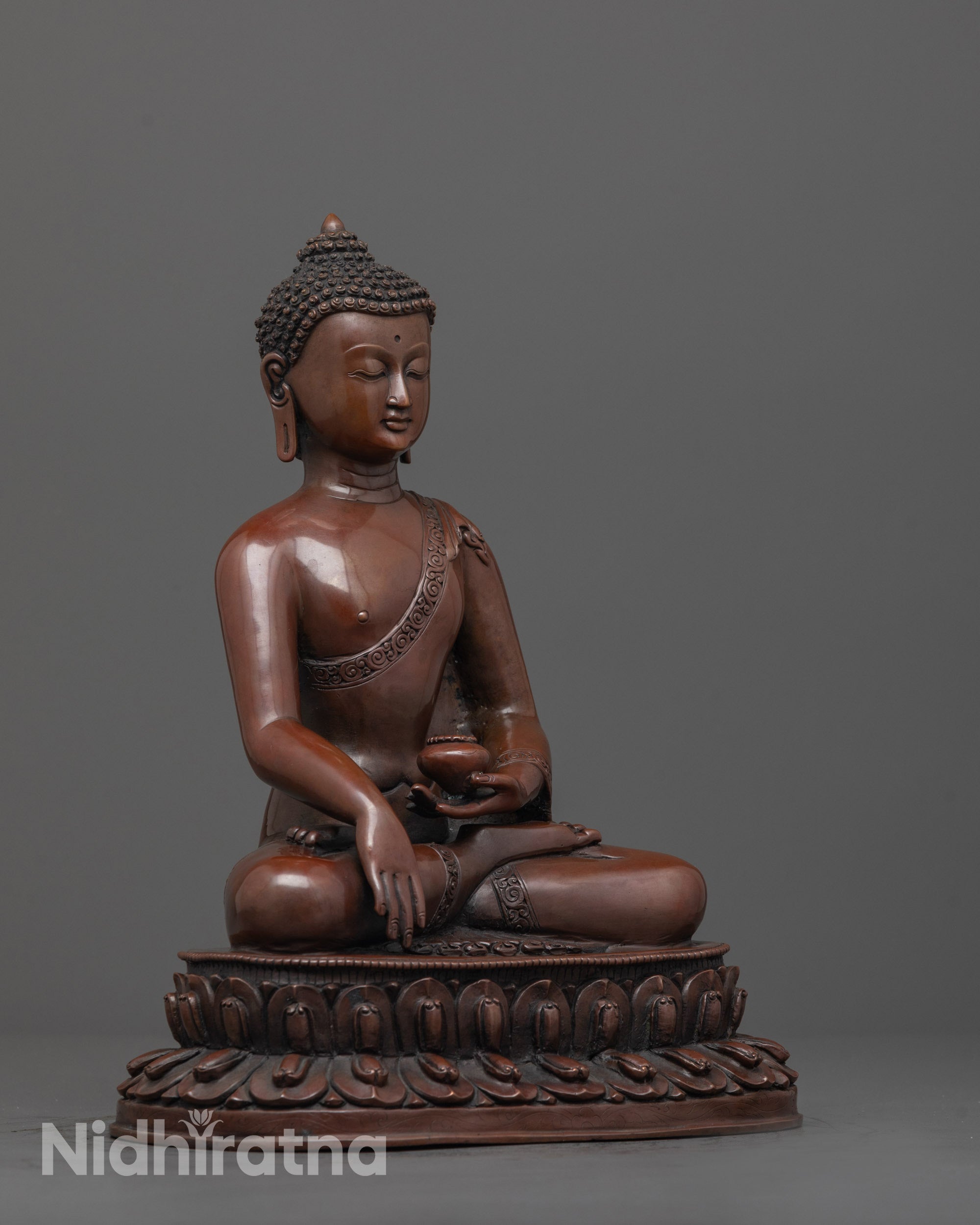 Side angle of Shakyamuni Buddha statue on double-layered lotus seat with natural earthy hue
