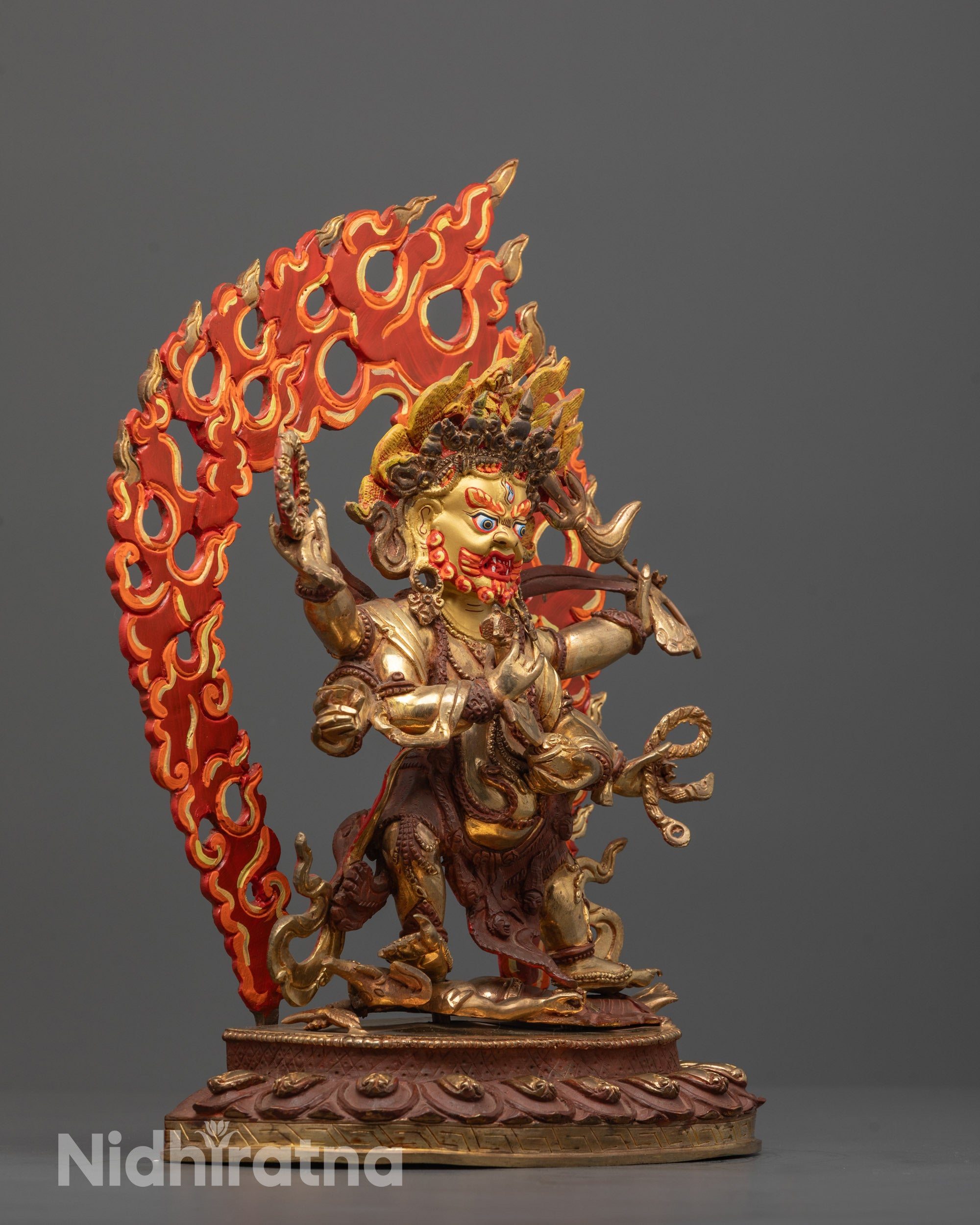 Side angle of Six-Armed Mahakala statue featuring six arms holding symbolic ritual objects