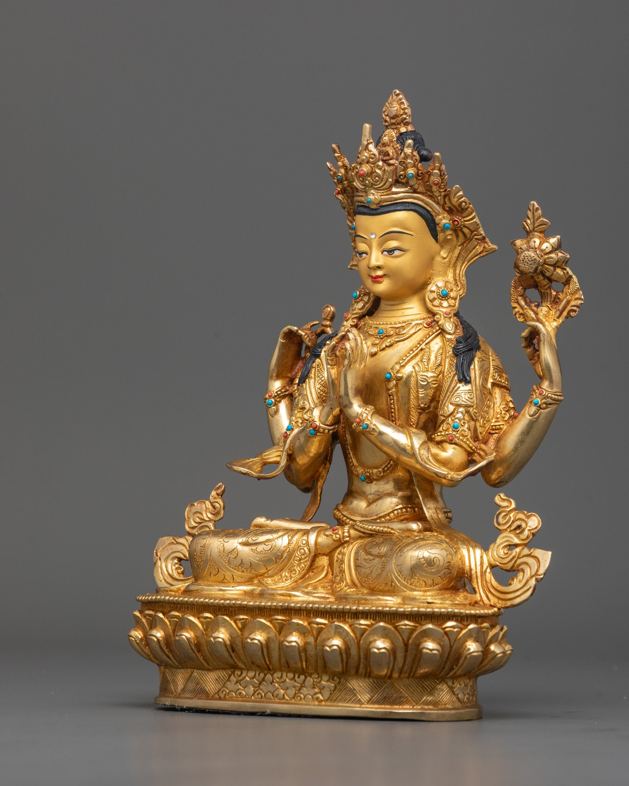 Side angle of Tibetan Chenrezig statue with detailed robe and 24K Gold Fire-gilded body
