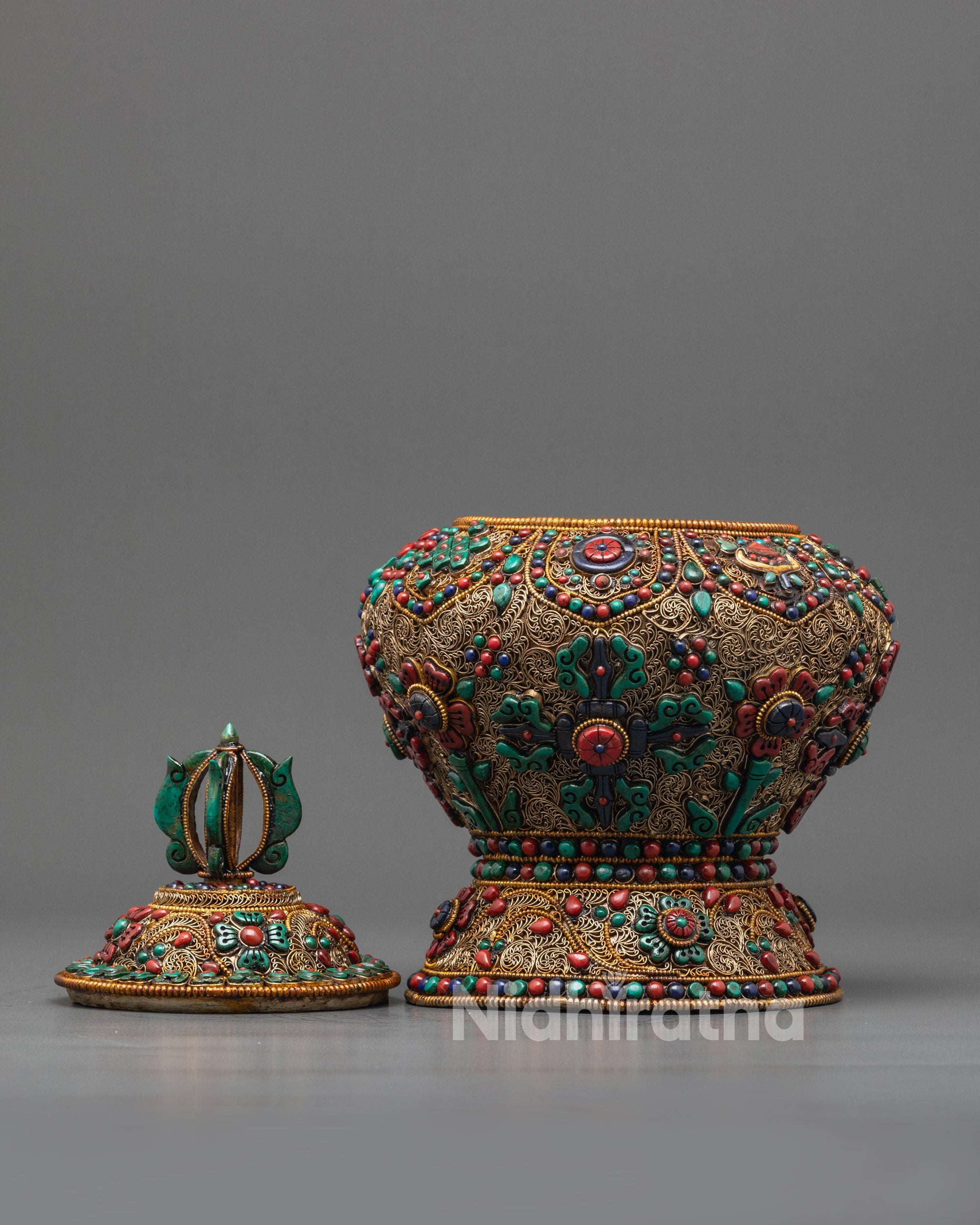 Side angle of Tibetan Ricepot showcasing intricate copper carvings and turquoise lid