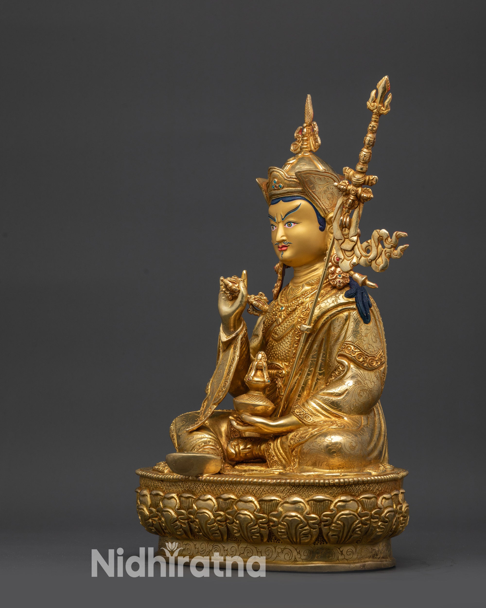 Side angle of Tsokye Dorje statue with khatvanga trident traditional Himalayan art