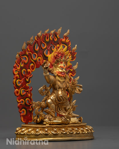 Side angle of Vajrapani statue showing two hands holding symbolic ritual objects