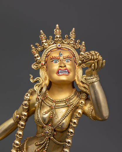 Side angle of Vajrayogini statue with kartika knife, skull cup, and khatvanga trident