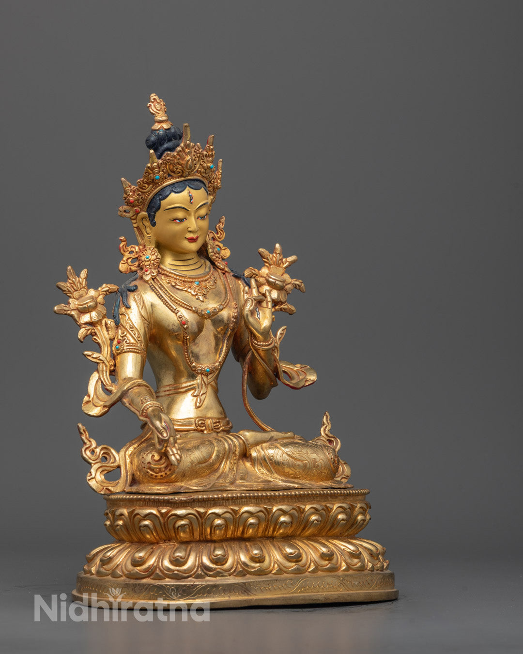 Side angle of White Tara Sculpture showing intricate carvings by master Nepalese artisan
