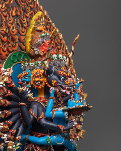 Side angle of black-hued Yamantaka and blue-hued consort with blazing halo details