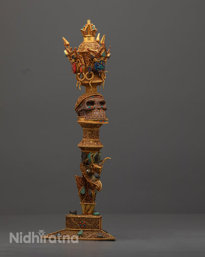 Side angle of copper ritual Phurba showing detailed copper accents and painted designs