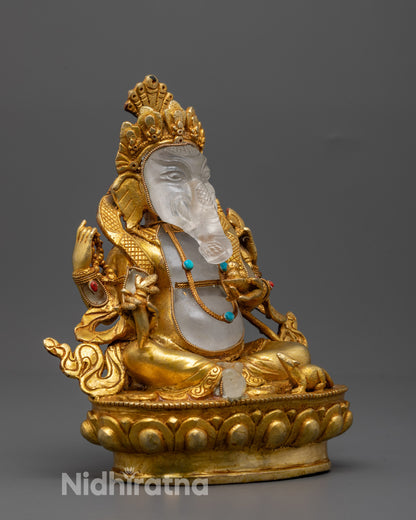 Side angle of divine Ganesh statue holding modak, mala, axe, and broken tusk