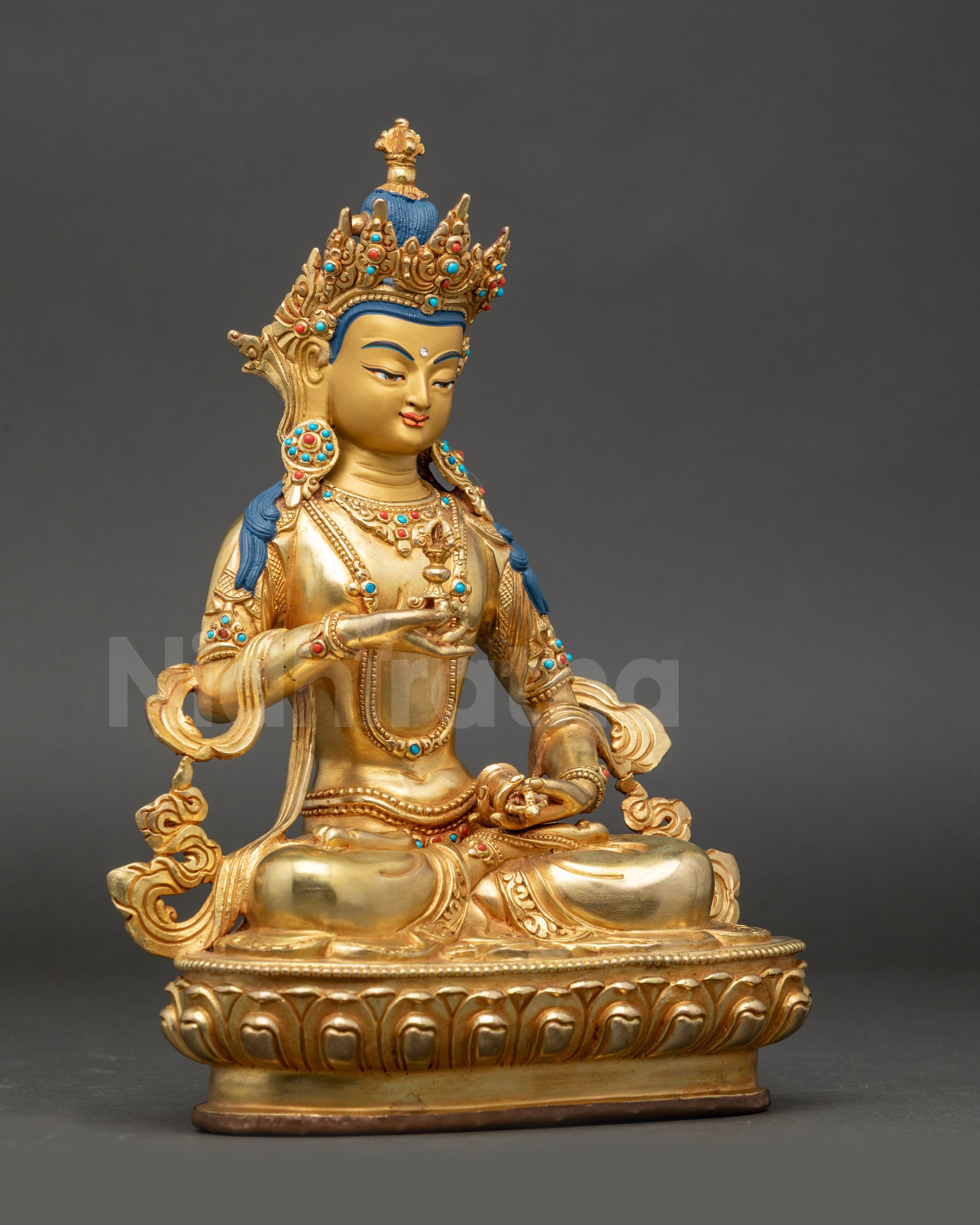 Side angle of gold-gilded Vajrasattva copper statue with jeweled crown
