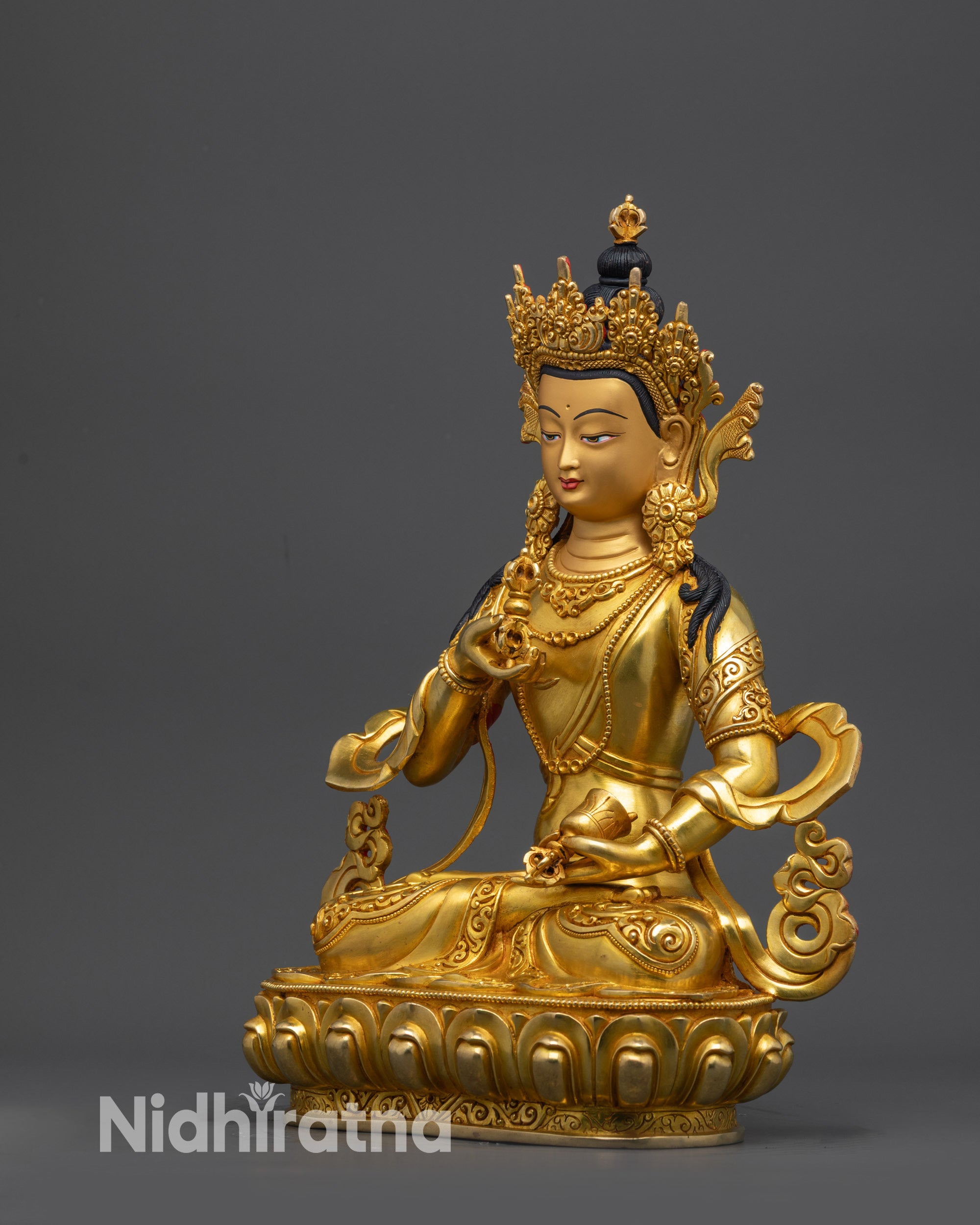 Side angle of gold fire-gilded Vajrasattva Statue seated on lotus in lotus posture