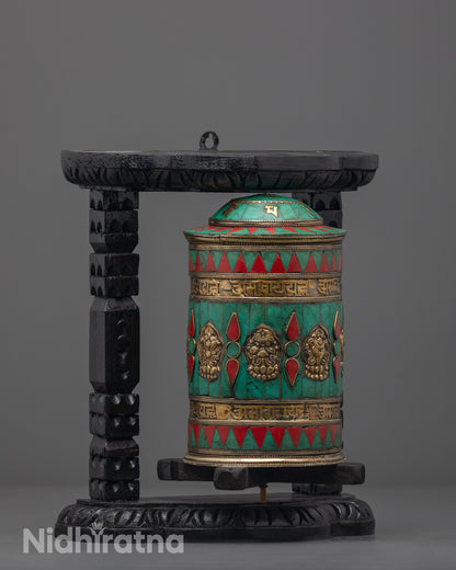 Side angle of handcrafted Auspicious Prayer Wheel featuring eight auspicious symbols and semi-precious stones