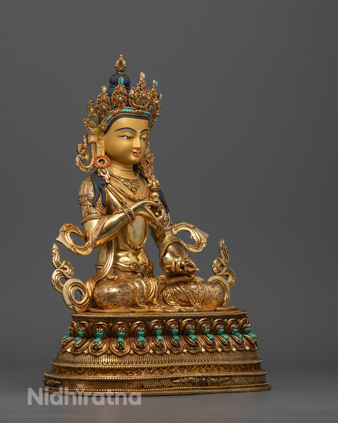 Side angle of handcrafted Dorje Sempa Statue showing detailed crown and lotus throne gems