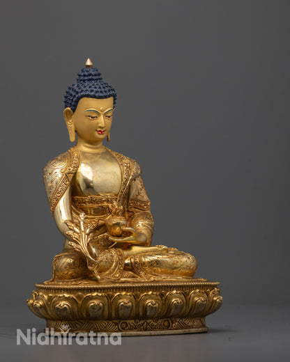 Side angle of handcrafted Medicine Buddha showing robe patterns and lotus seat