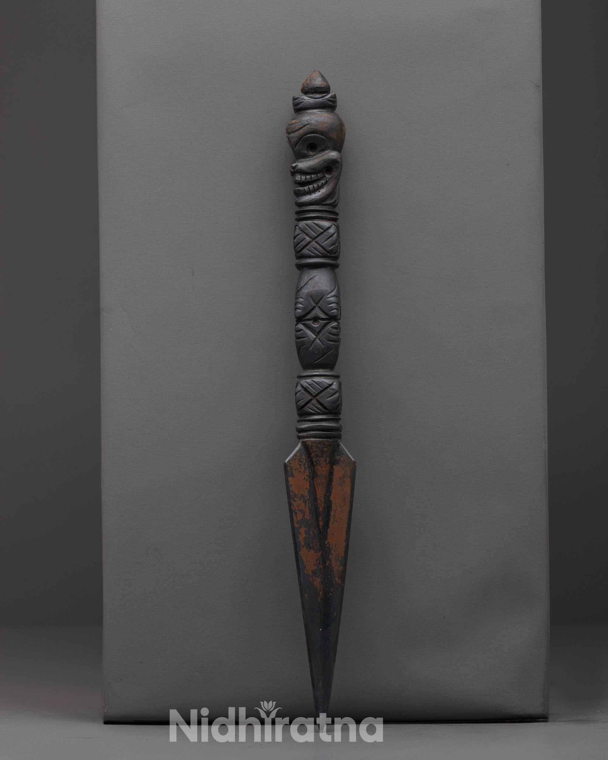 Side angle of handcrafted Phurba ceremonial dagger for spiritual protection