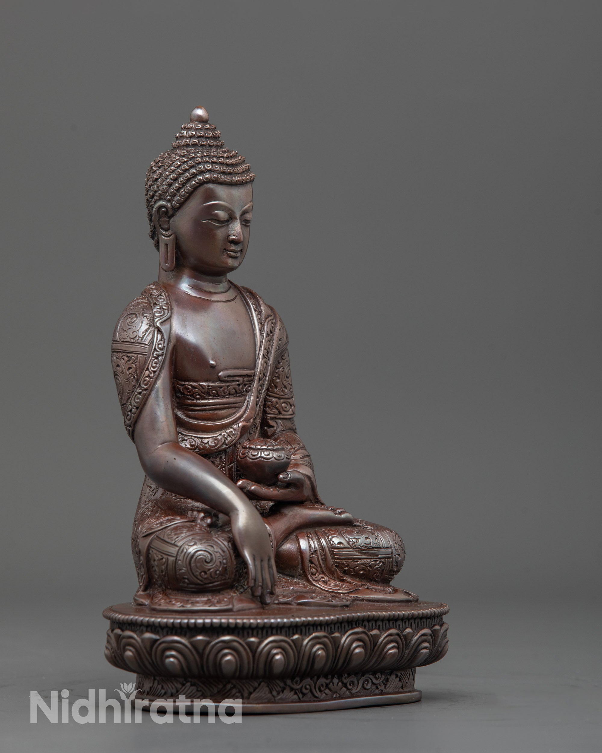 Side angle of handcrafted Shakyamuni Buddha seated in bhumisparsha mudra on lotus seat