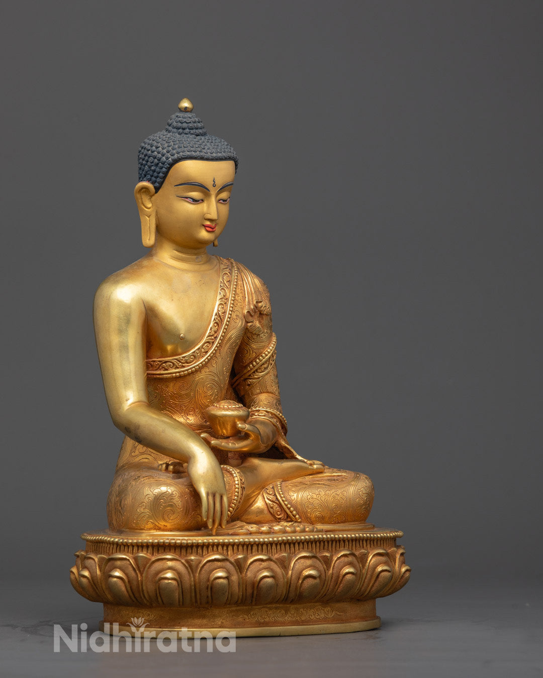Side angle of handcrafted Shakyamuni Buddha statue holding Patra bowl in Bhumisparsha Mudra