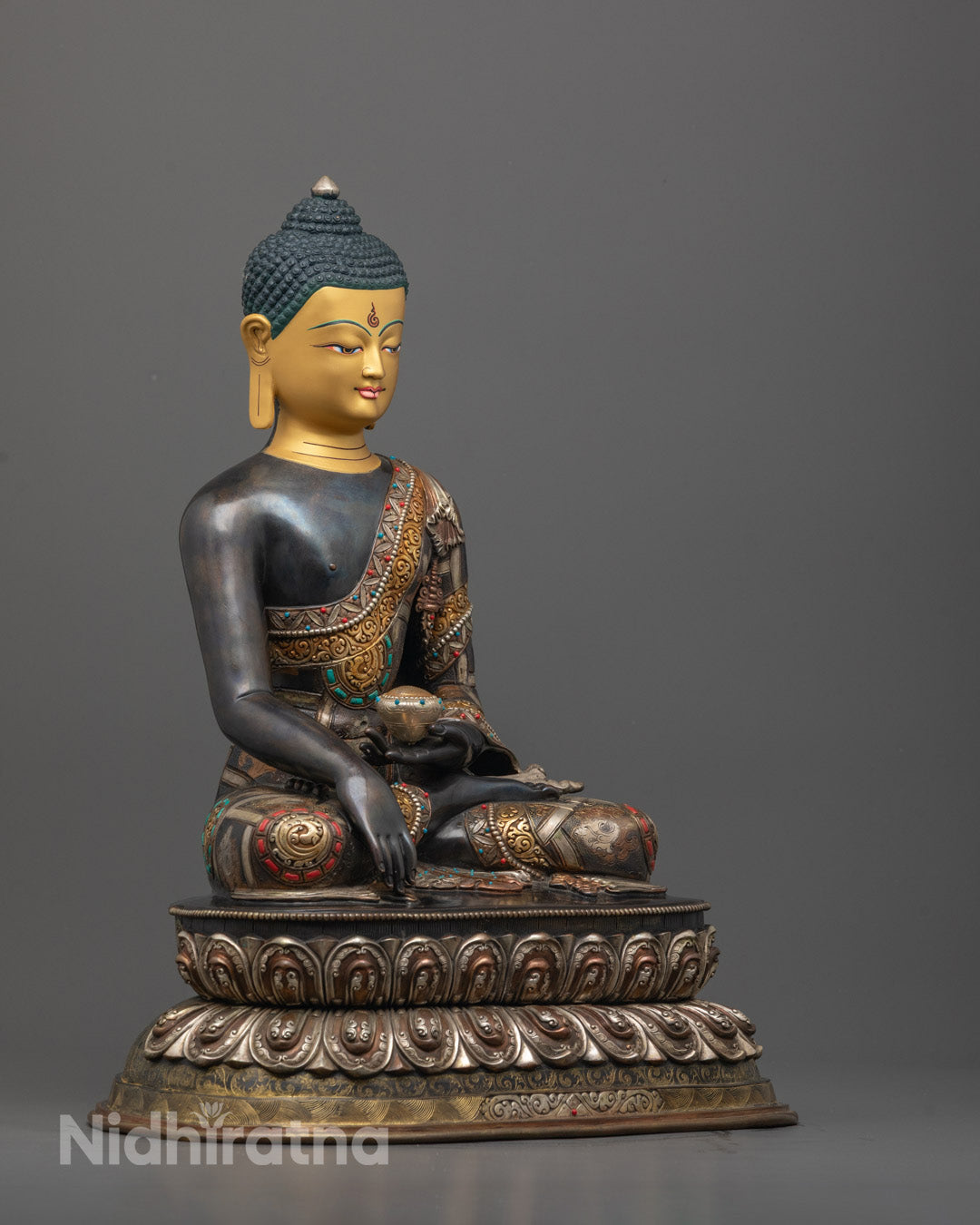 Side angle of handcrafted Shakyamuni Statue on lotus seat with oxidized copper and intricate carvings