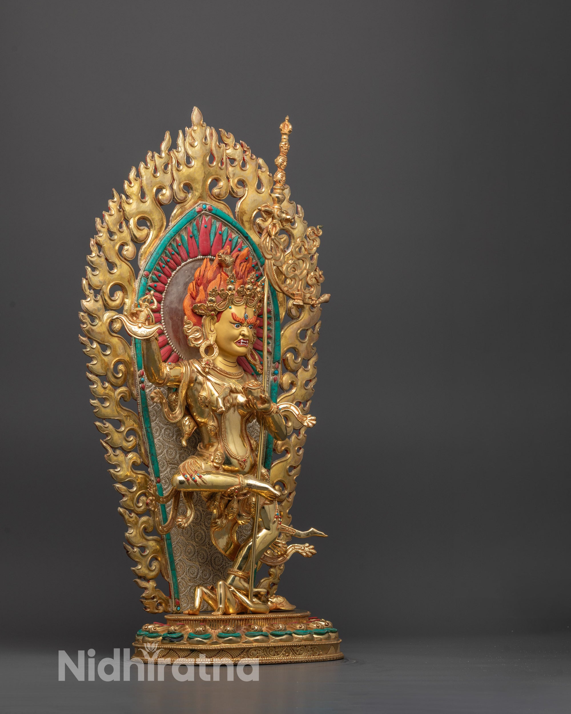 Side angle of handcrafted Troma Nagmo statue with skull ornaments and hollow chamber