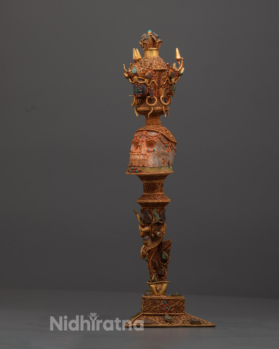 Side angle of handcrafted crystal Phurba showcasing intricate copper and acrylic design