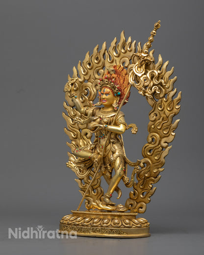 Side angle of handcrafted gold-gilded Troma Nagmo statue in dynamic dancing posture