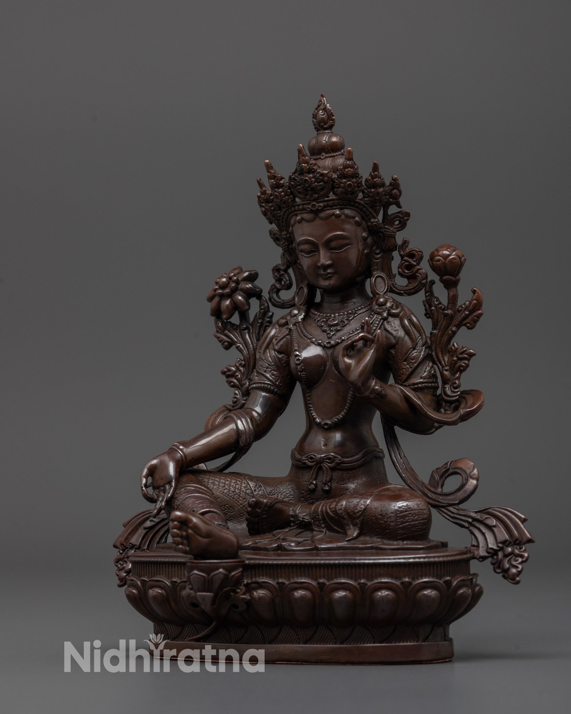 Side angle of machine-made Green Tara statue symbolizing protection and compassion