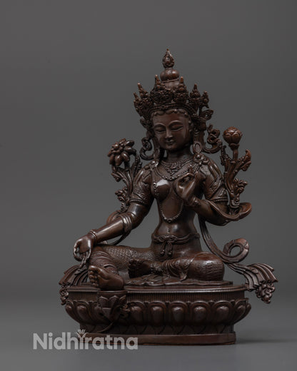 Side angle of machine-made Green Tara statue symbolizing protection and compassion