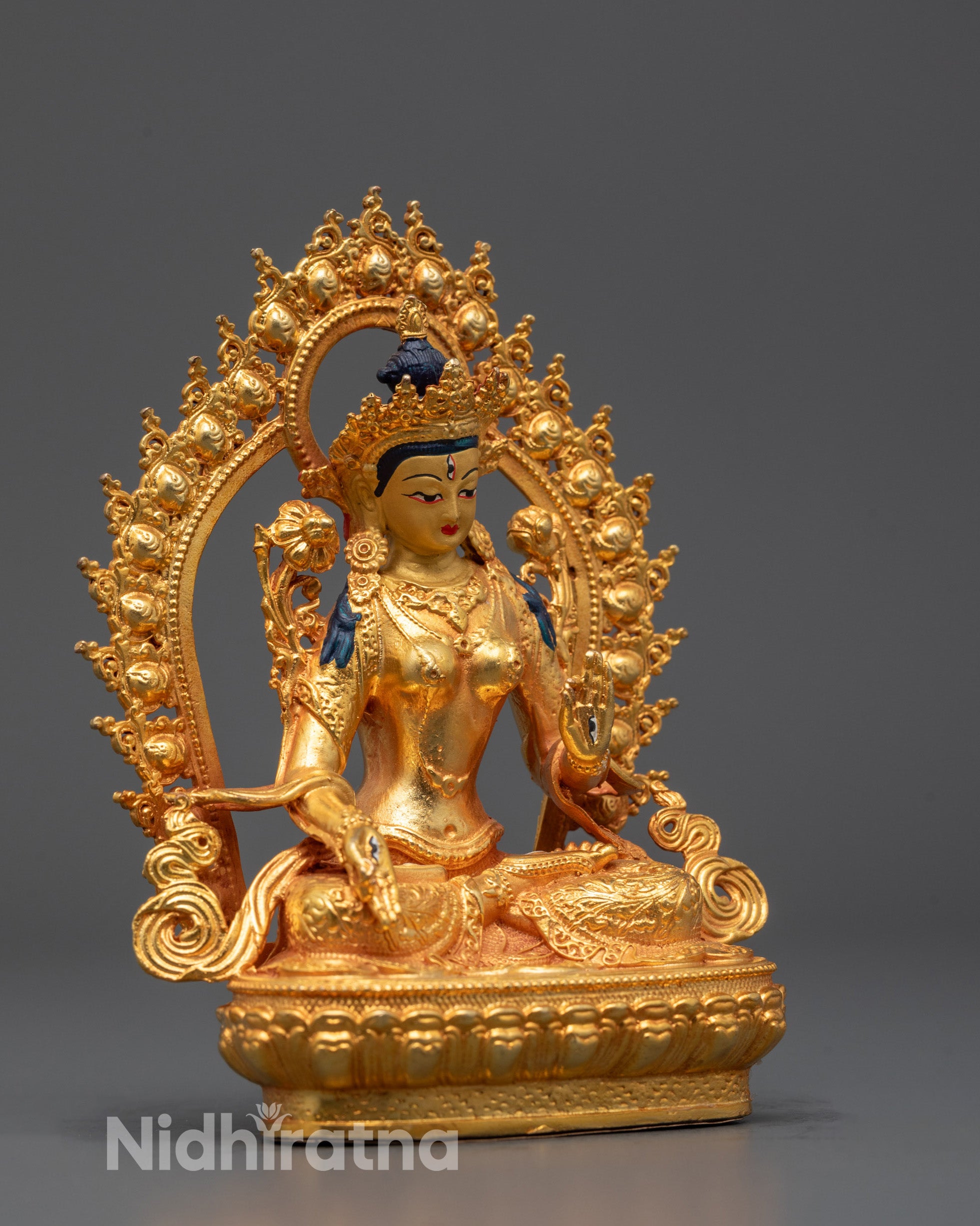 Side angle of machine-made White Tara Sculpture showing radiant halo