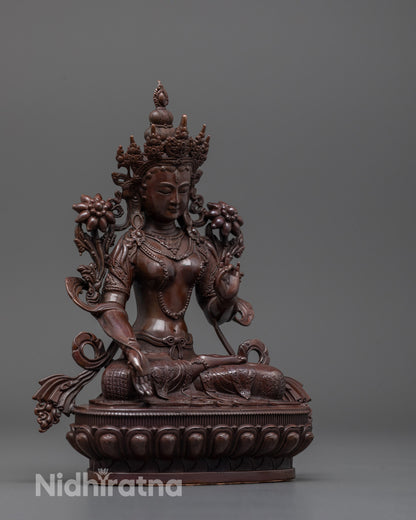 Side angle of machine-made White Tara statue in oxidized copper with intricate craftsmanship