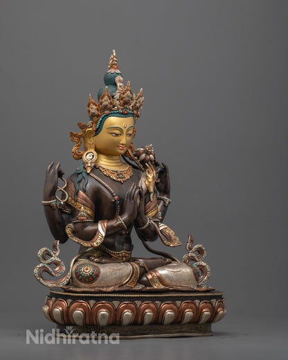 Side angle of oxidized Chenrezig Sculpture showing four arms and gold-silver plated accents
