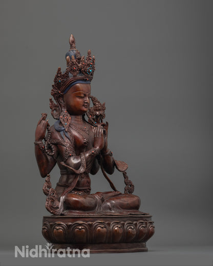 Side angle of oxidized copper Chenrezig Statue highlighting swirling robe and brownish hue