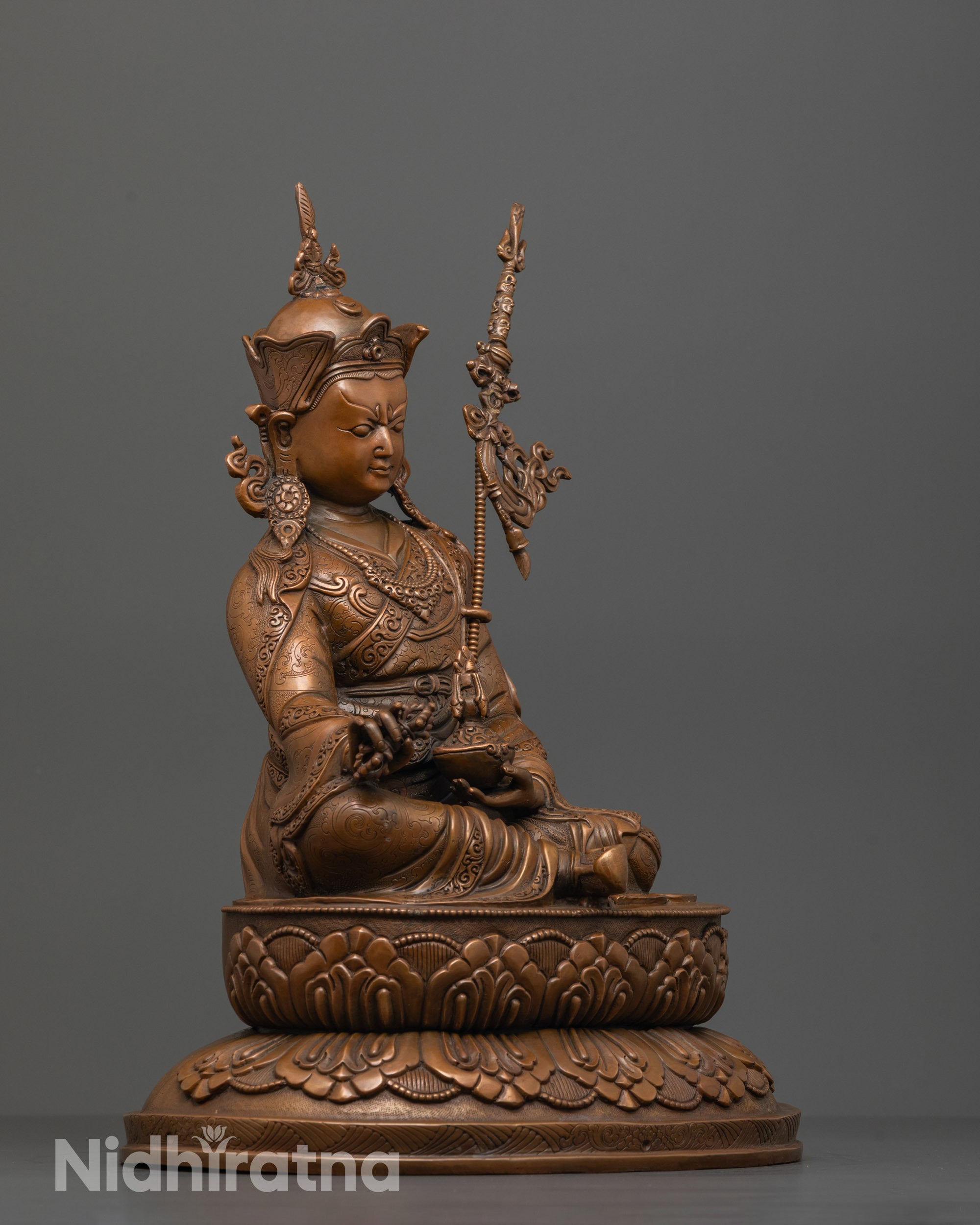Side angle of semi-wrathful Guru Padmasambhava statue handcrafted in lost wax technique
