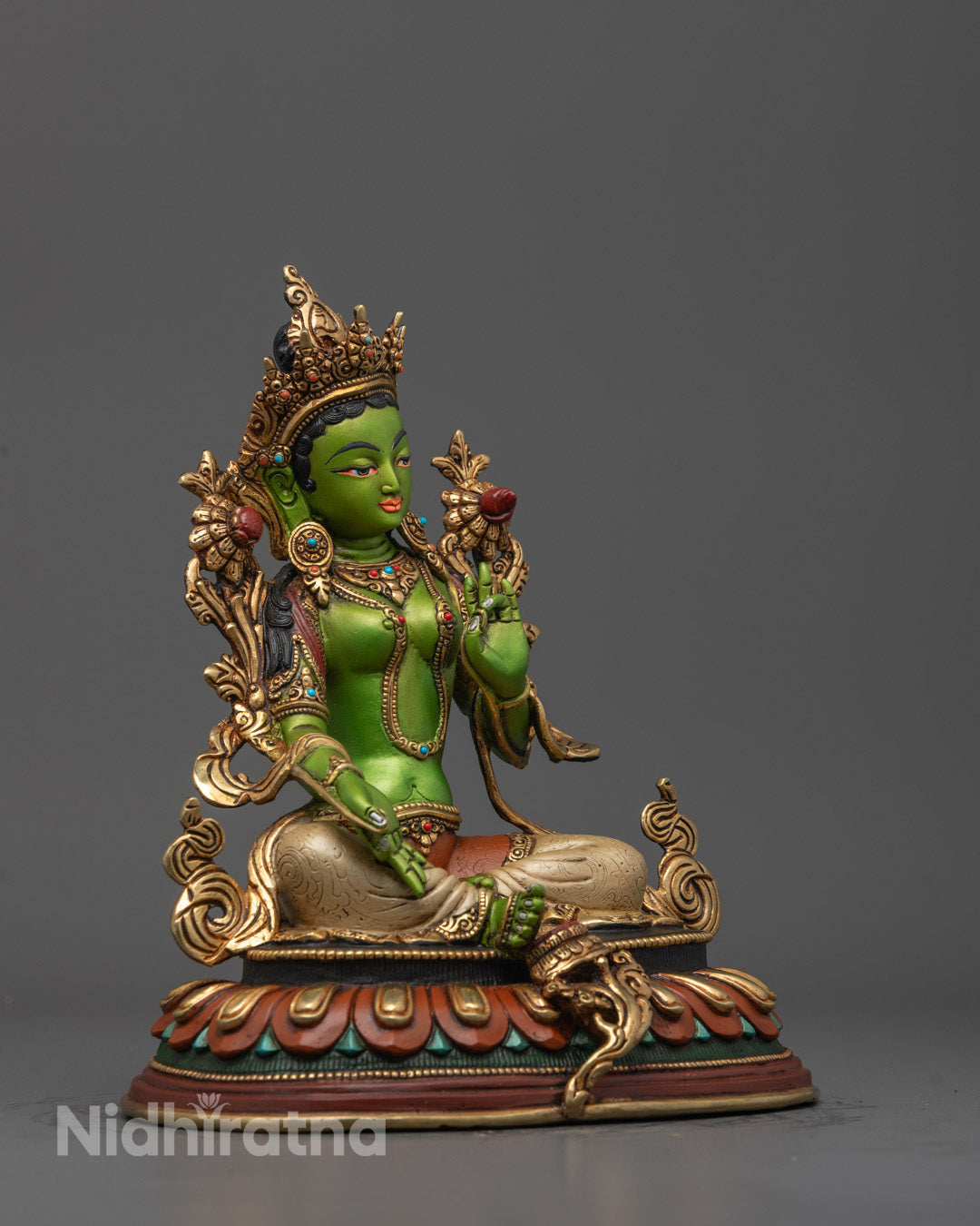 Side angle of the Green Tara Statue highlighting the lotus base, elegant posture