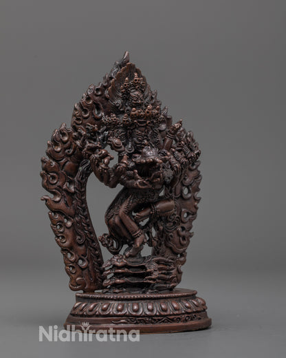 Side angle of the Hevajra statue showing the detailed multiple arms and sacred objects