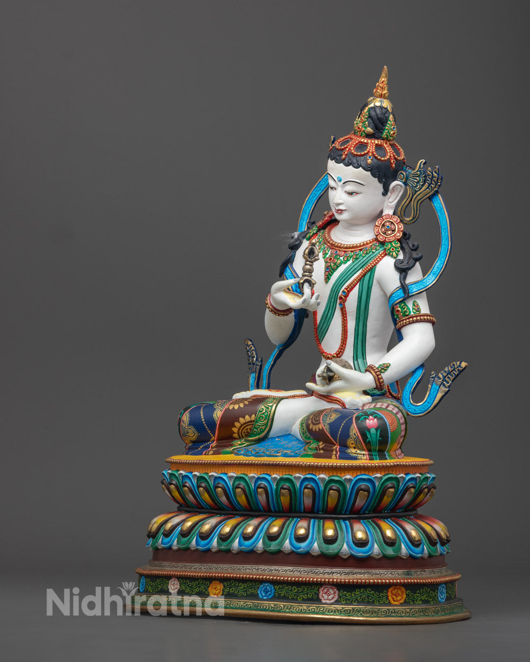 Nepalese Vajrasattva statue showcasing intricate robe designs, sacred symbols, and expert craftsmanship using the lost-wax method.