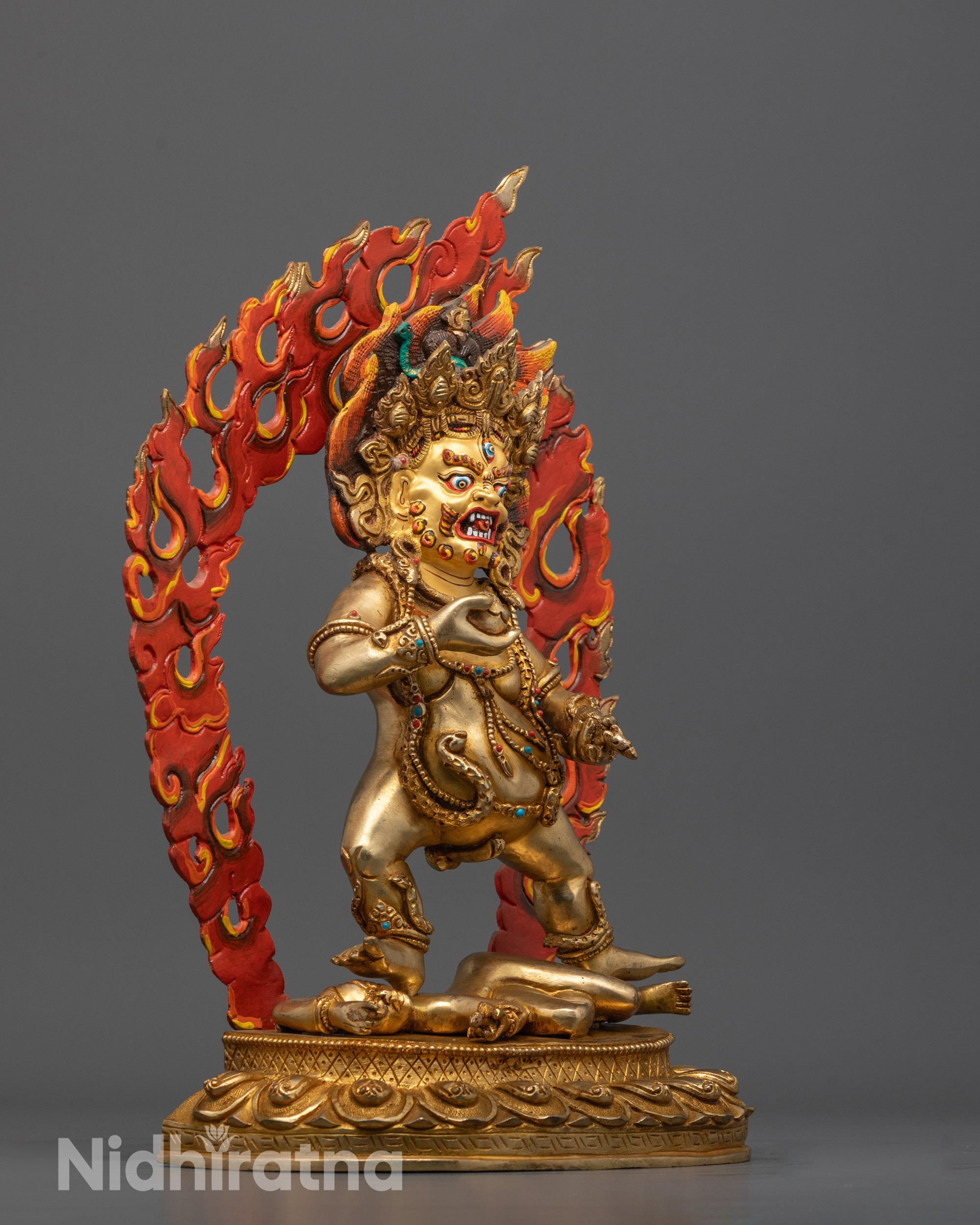 Side angle of traditional Nepalese Black Dzambhala copper statue highlighting intricate