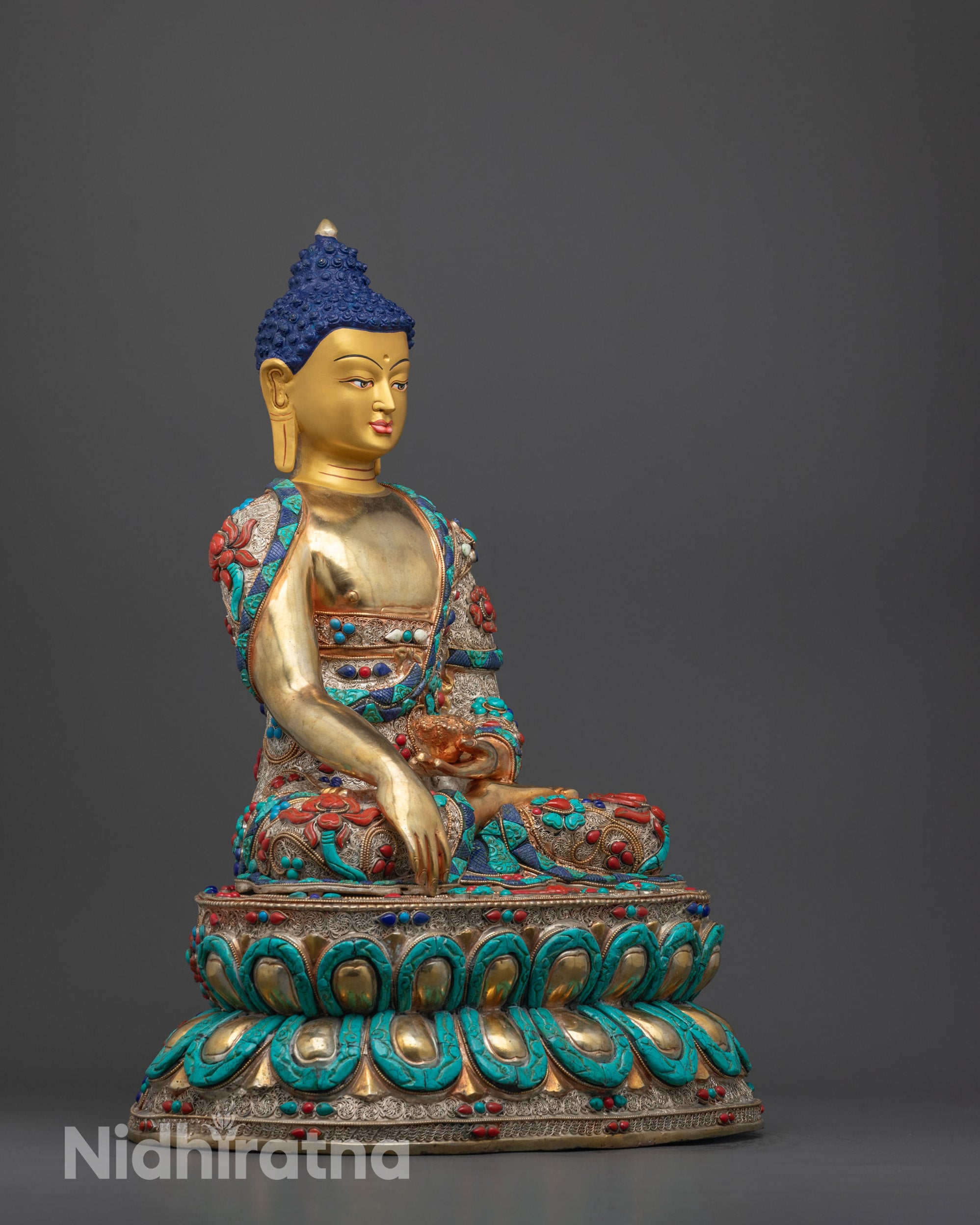 Side angle of traditional Nepalese Shakyamuni Buddha Statue highlighting craftsmanship