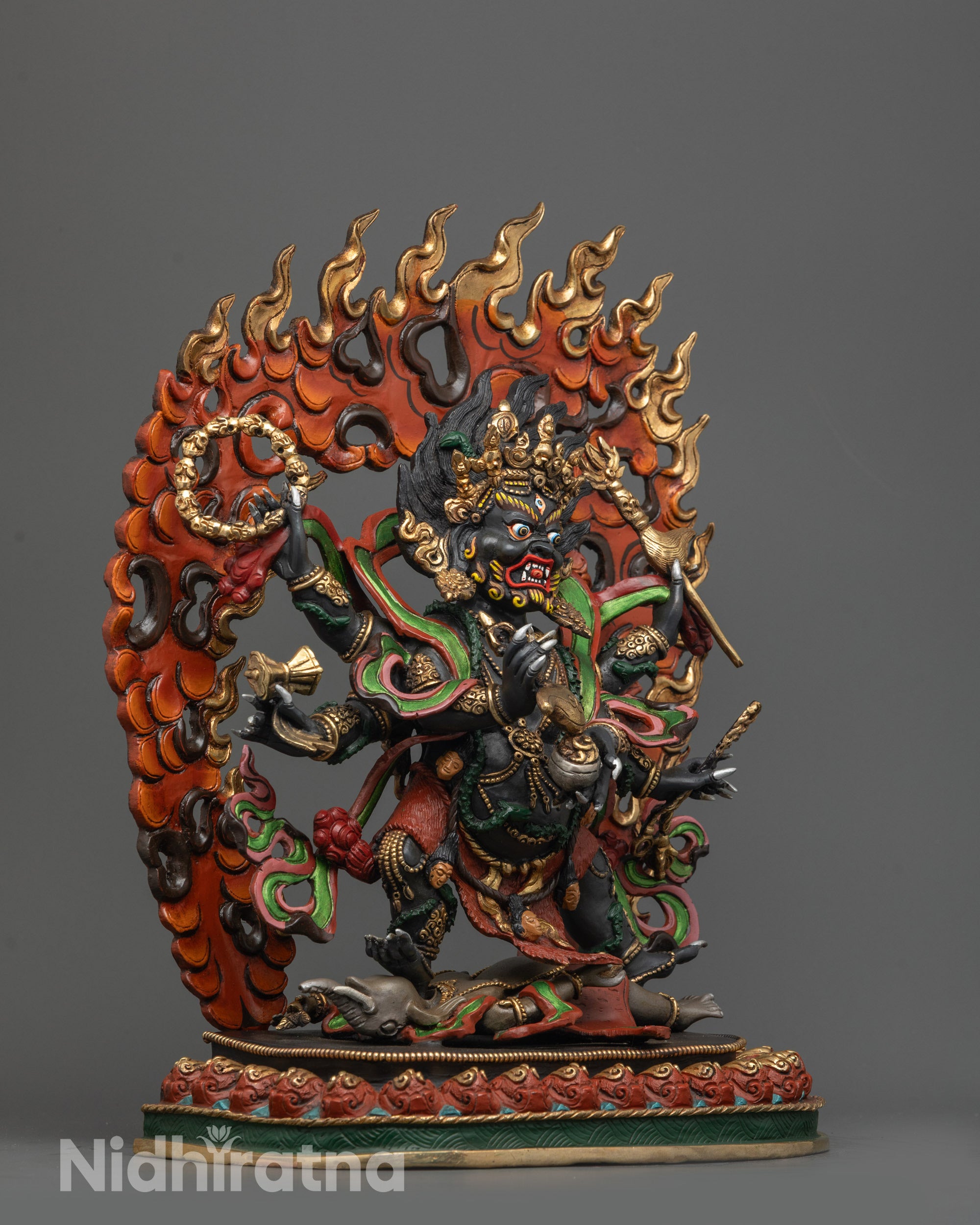 Side angle of wrathful Six-Armed Mahakala with three eyes, six arms holding