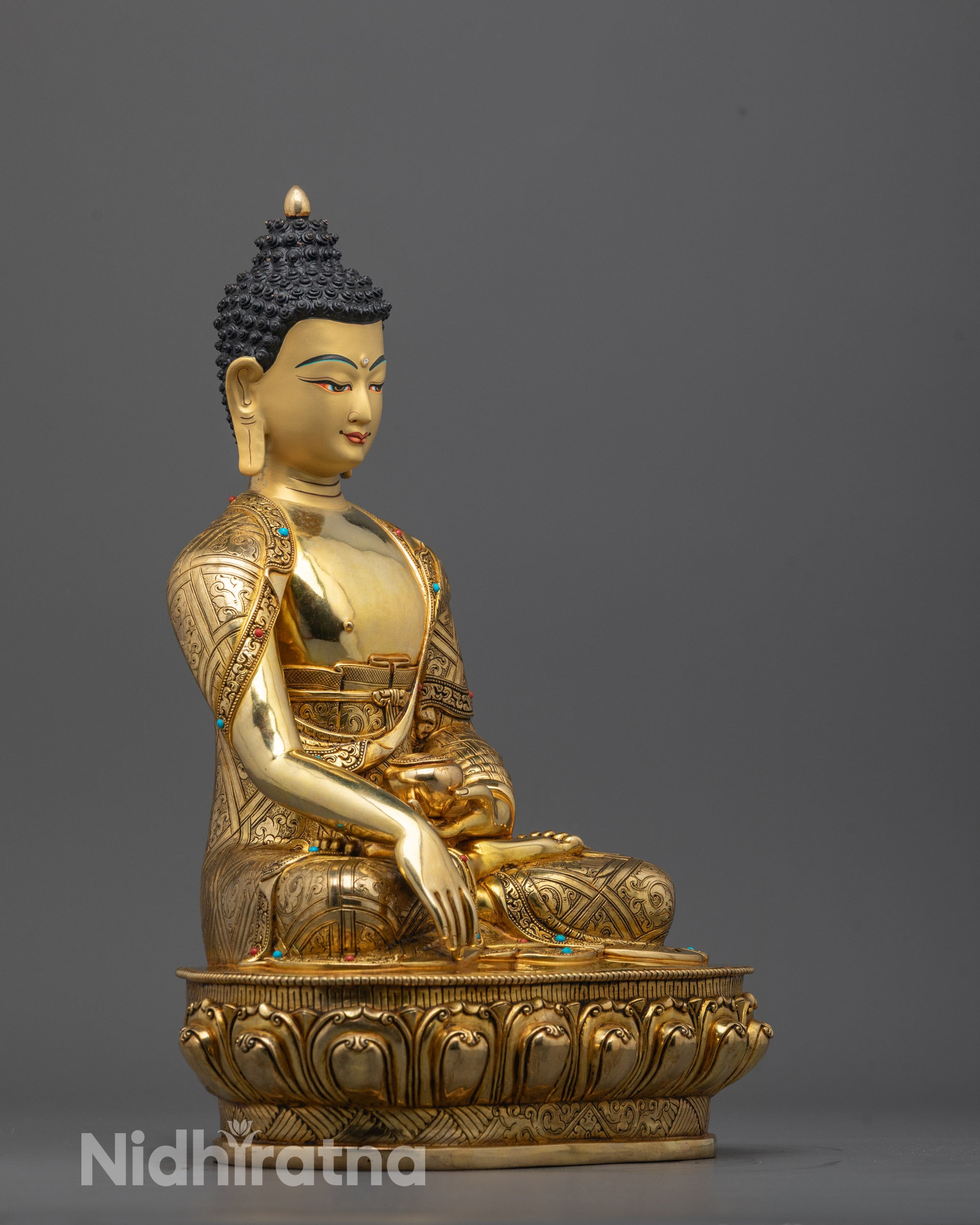 Side angle showing Buddha Shakyamuni statue holding alms bowl in earth-touching mudra pose