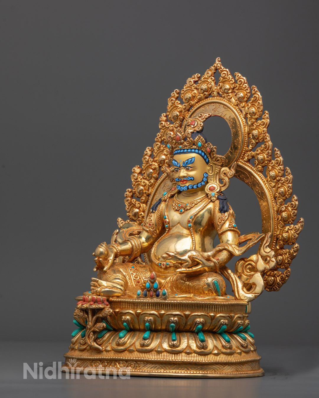 Side angle showing Dzambhala Statue holding the jeweled mongoose symbolizing wealth