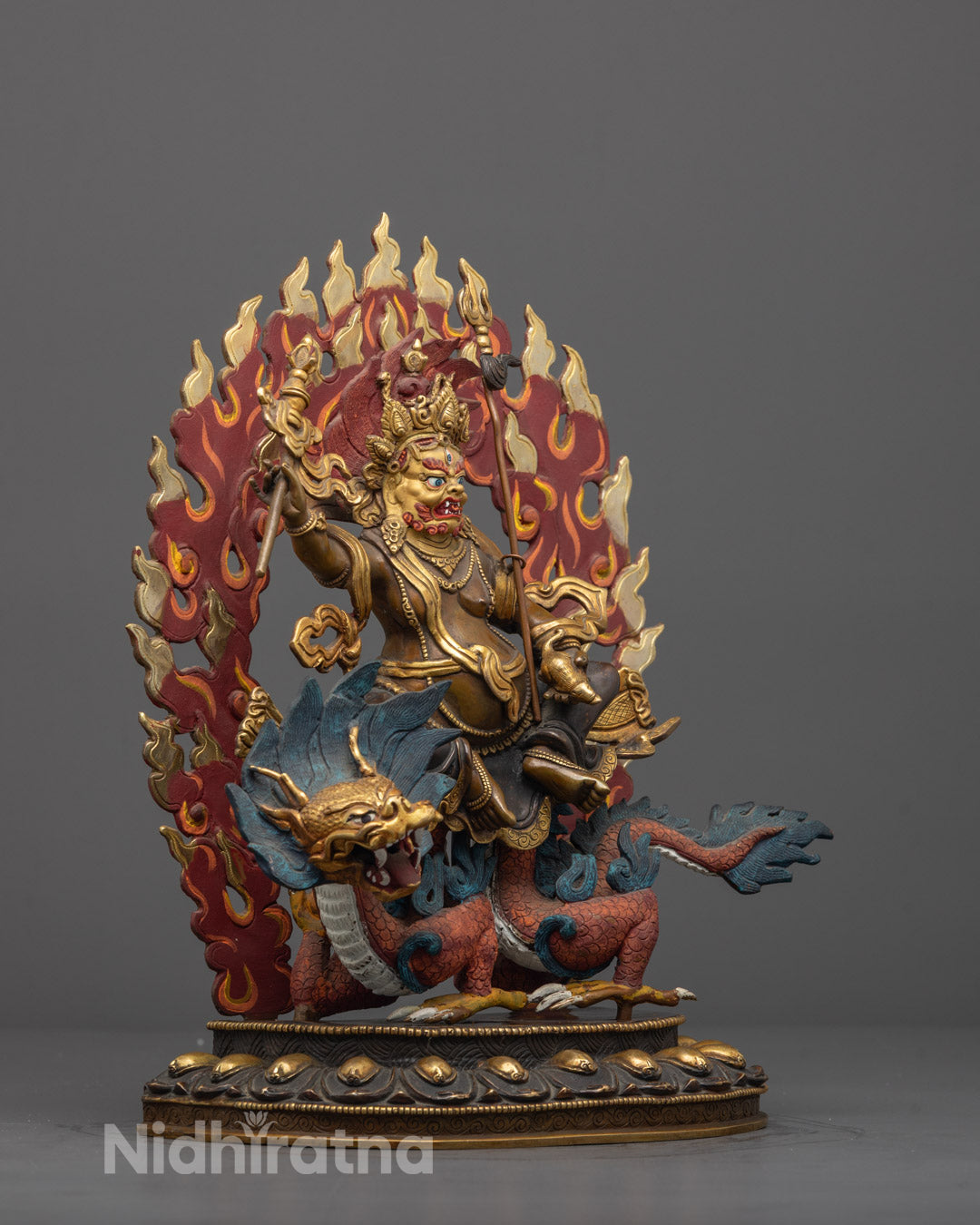 Side angle showing White Dzambhala holding jewel-spouting mongoose and Wealth Banner