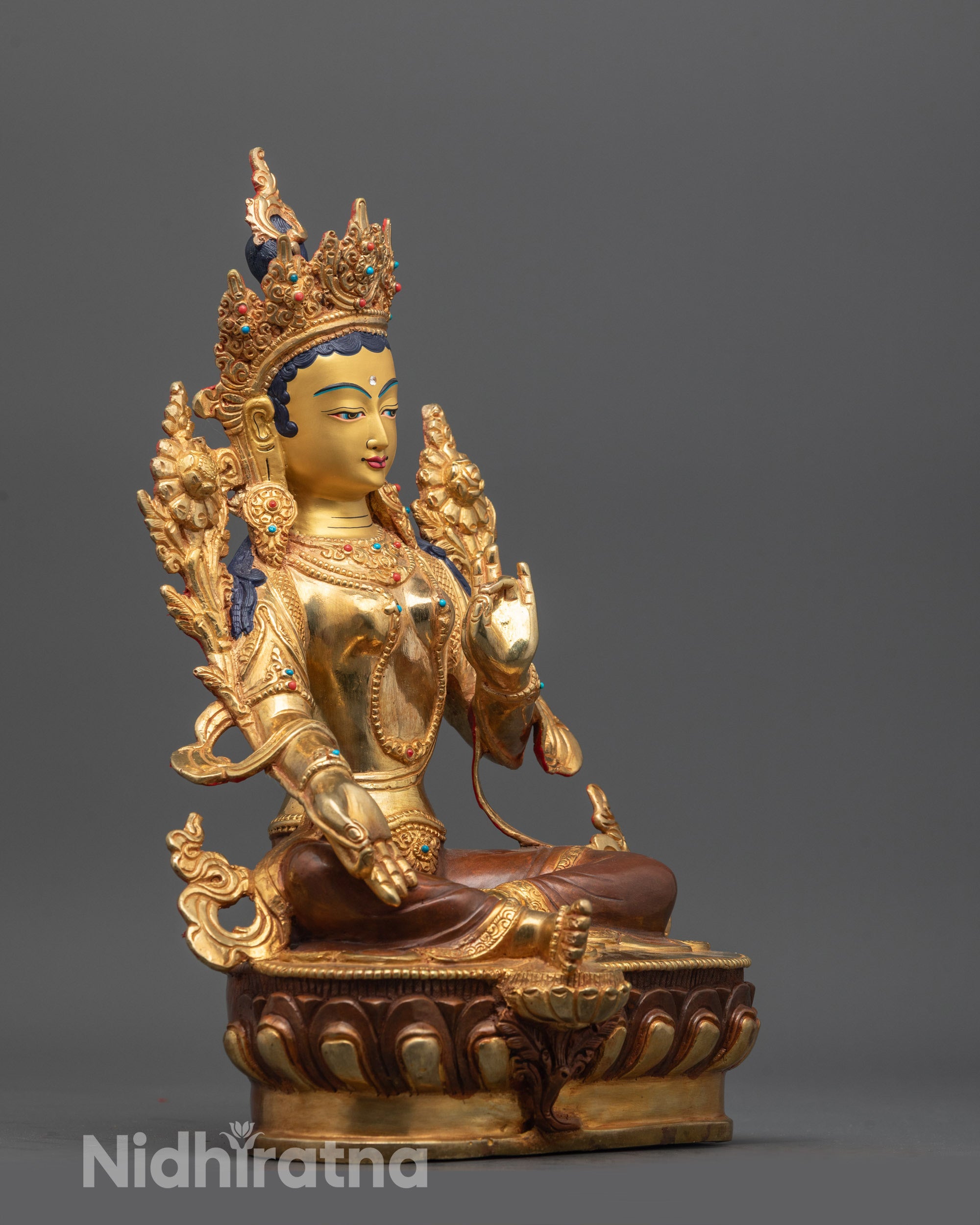 Side angle showing gold fire-gilded lower garments and copper base details