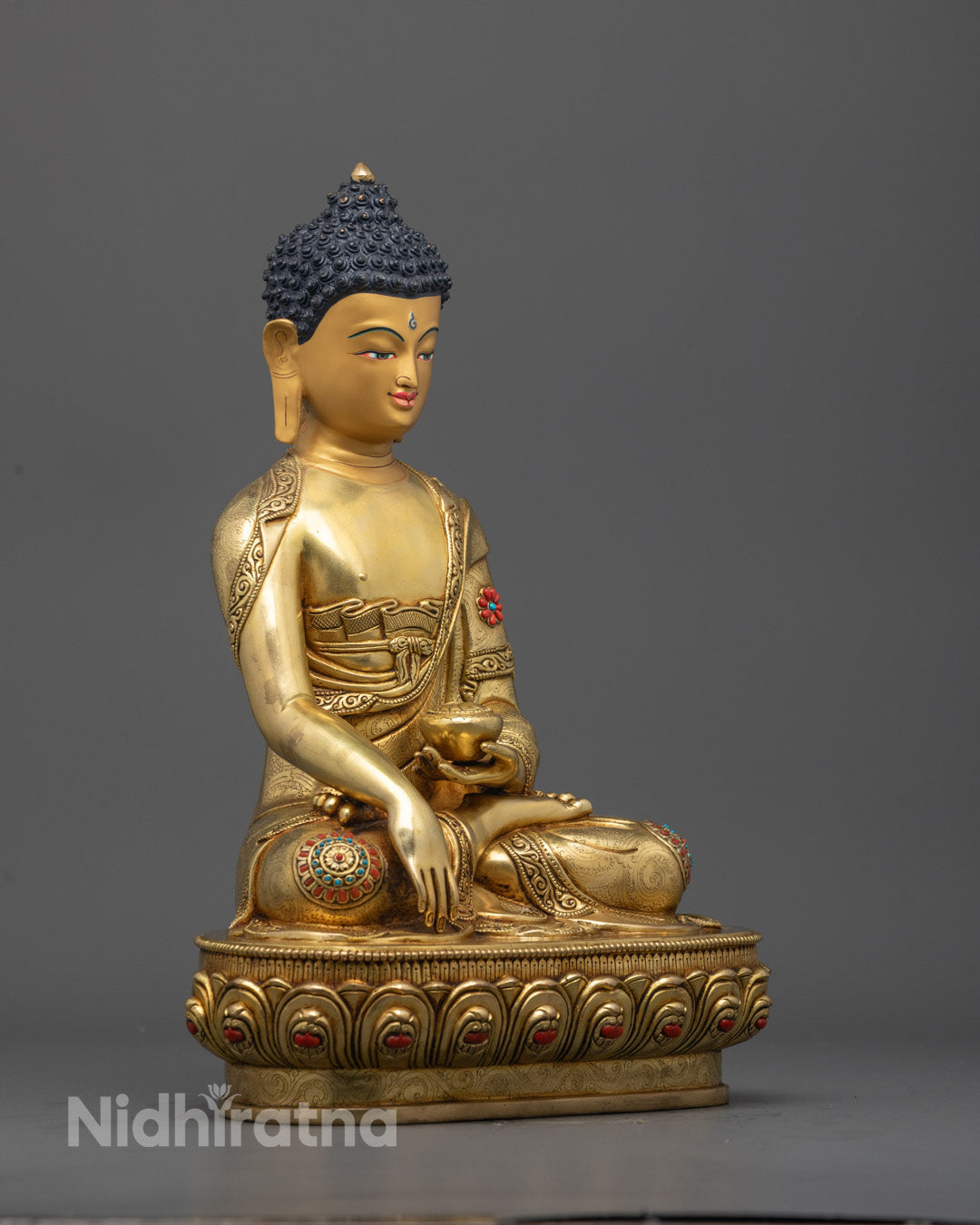 Side angle showing intricate carvings and patra bowl in earth-touching mudra pose
