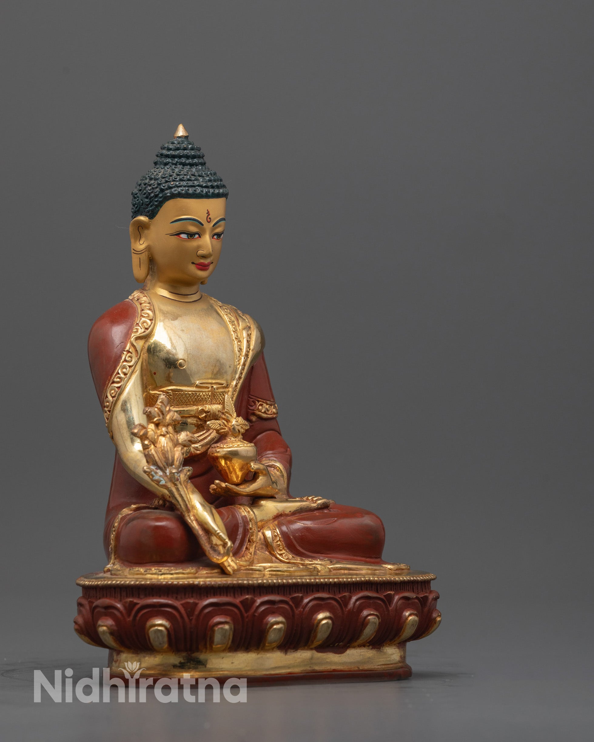 Side angle showing partially gold fire-gilded robe and copper body of Medicine Buddha Statue