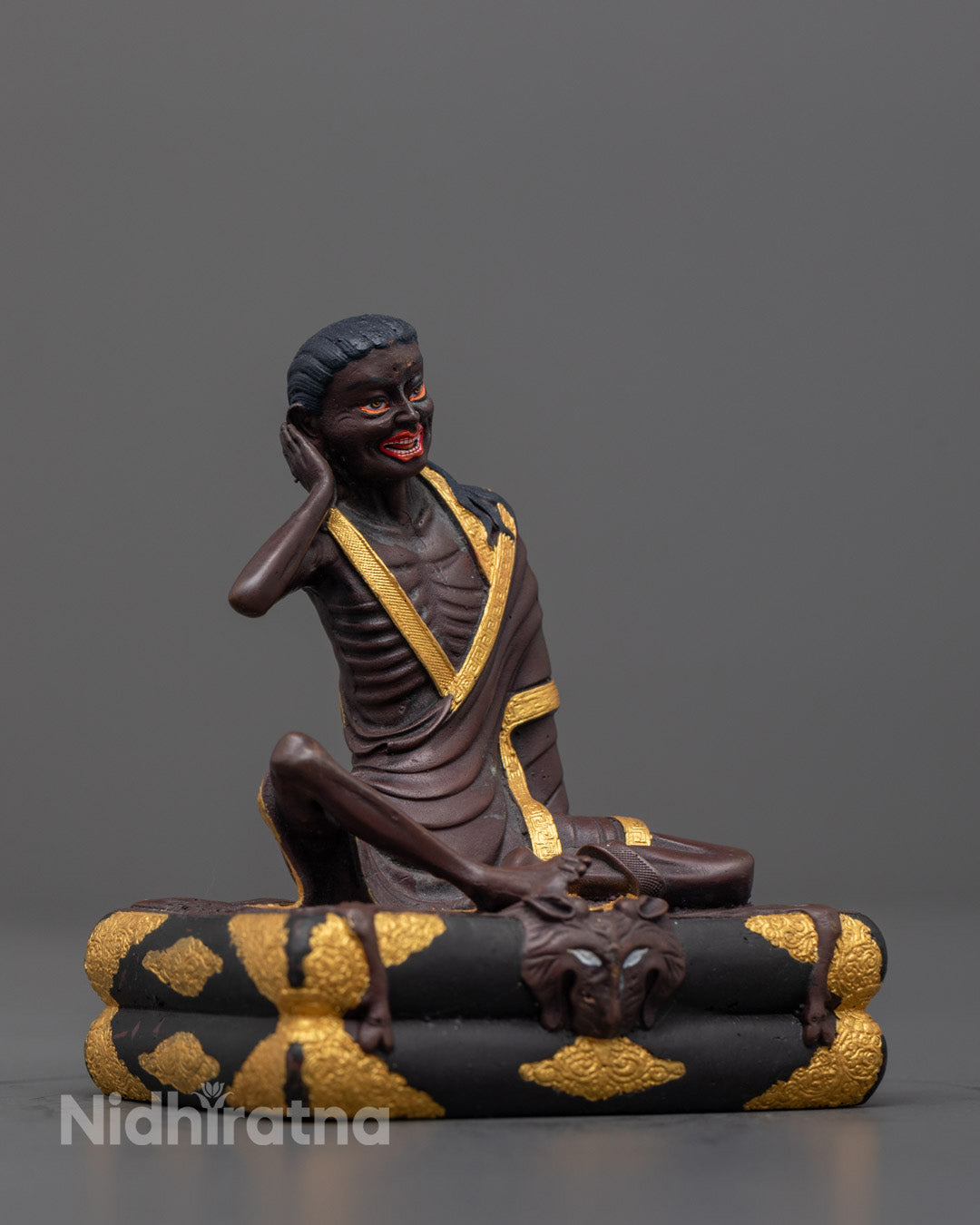 Side angle showing vibrant acrylic colors and carved robe on Milarepa statue