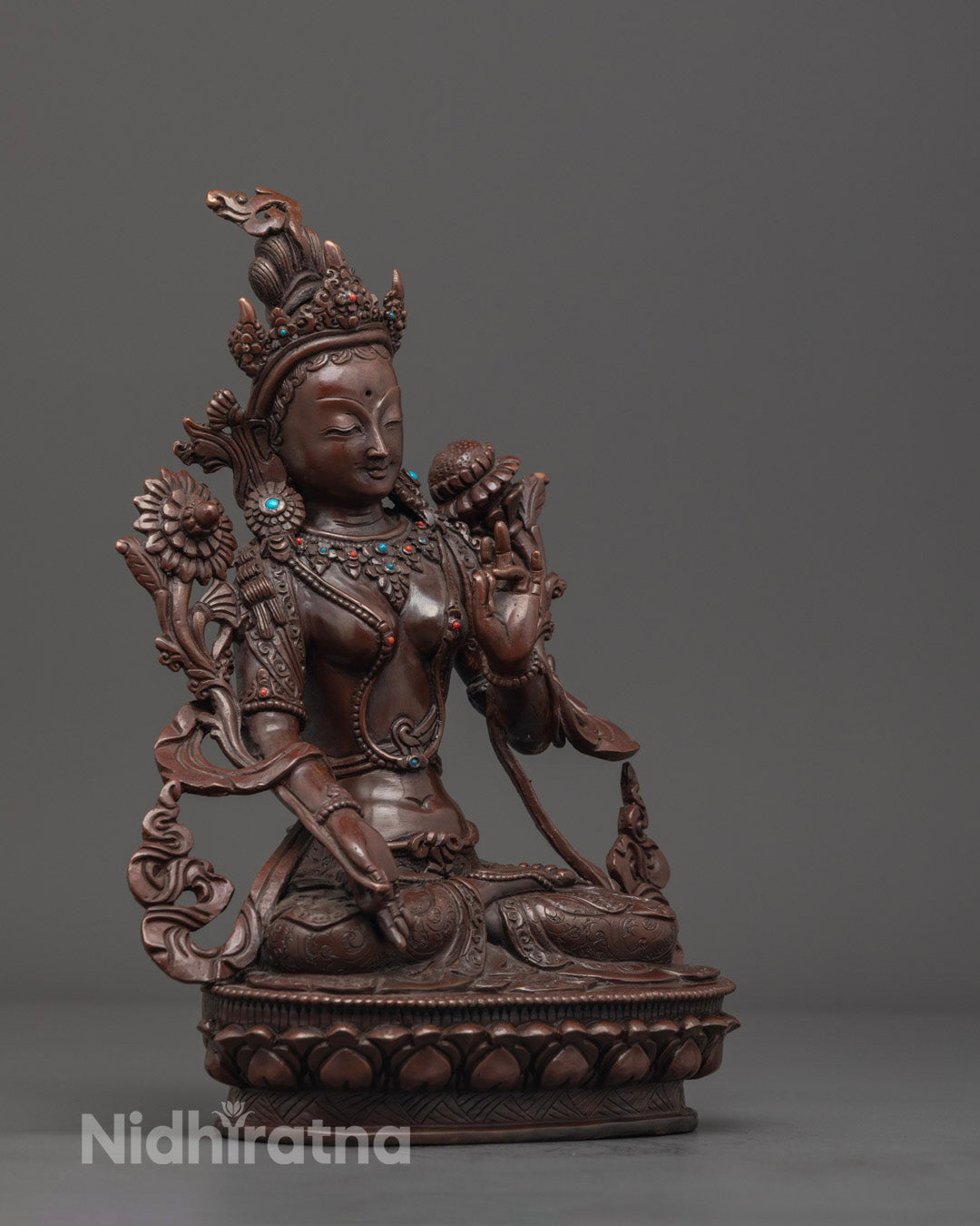 Side angle view showcasing the handcrafted details and flowing robes of the White Tara statue