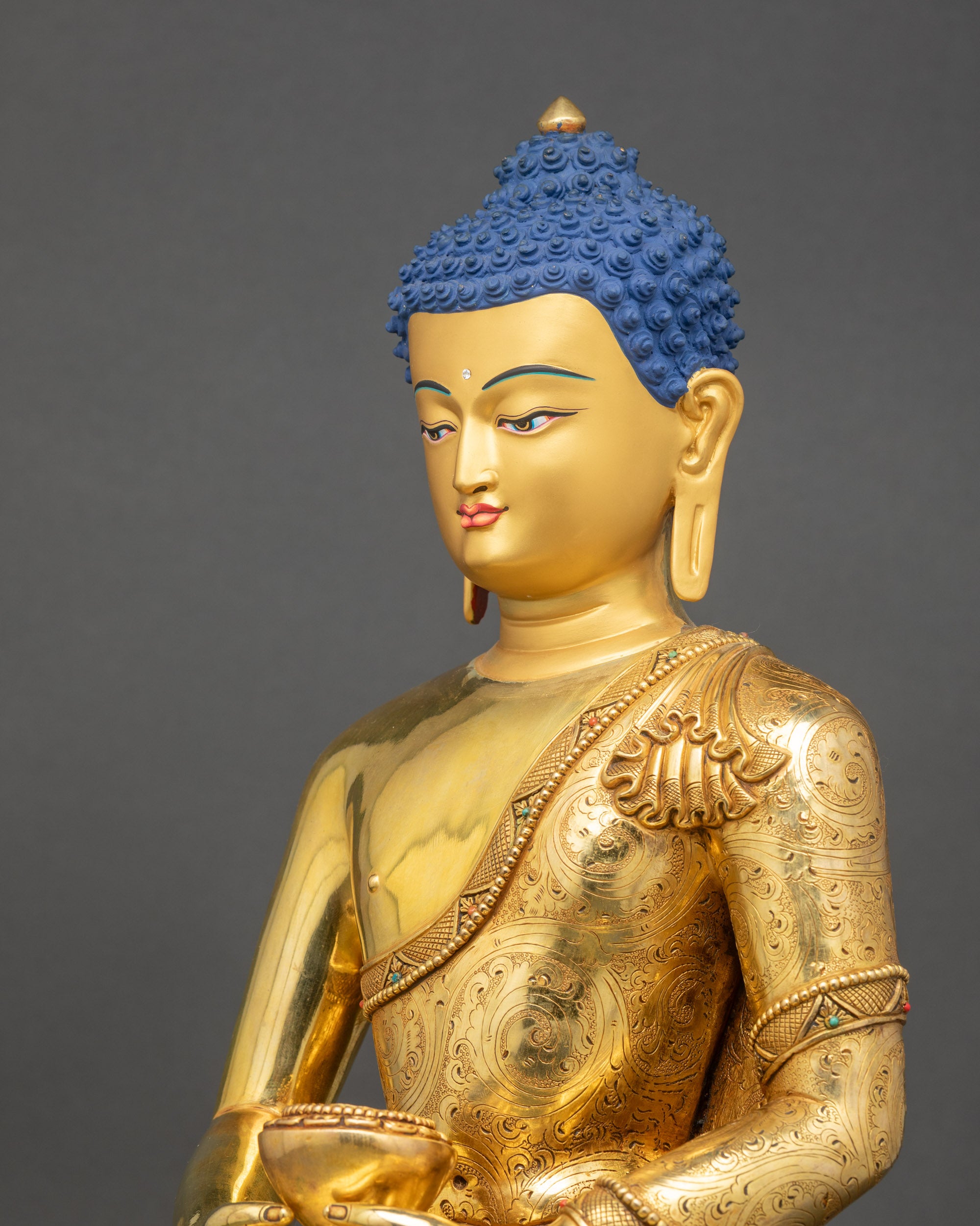 Side close-up of Amitabha Buddha highlighting intricate floral robe carvings