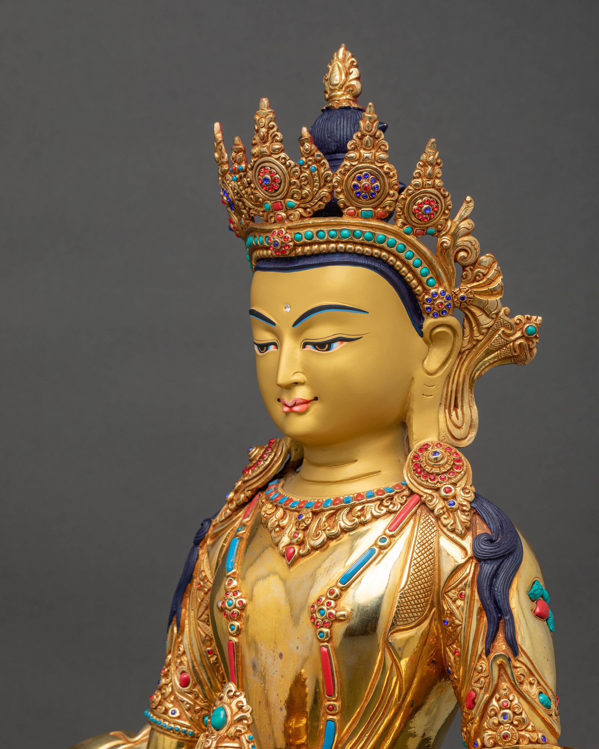 Side close-up of Amitayus Statue showing delicate carvings and gilded layers