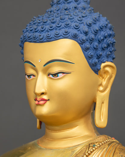 Side close-up of Buddha’s face highlighting gold-gilded features and calm gaze